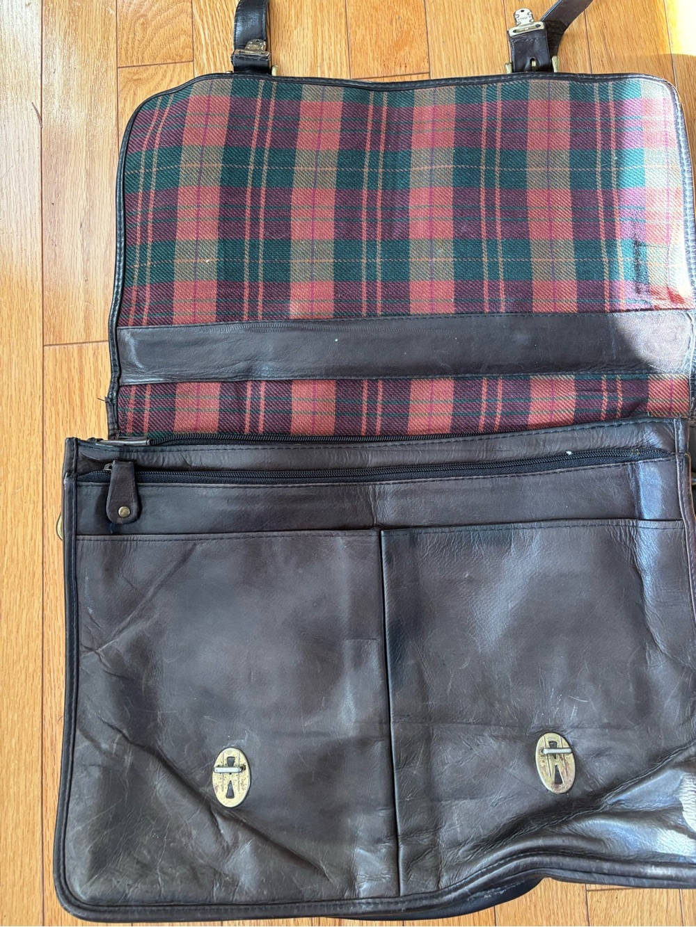 Vintage brown soft leather briefcase with plaid lining.